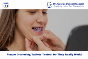 A person examining stained teeth in a mirror after using plaque disclosing tablets